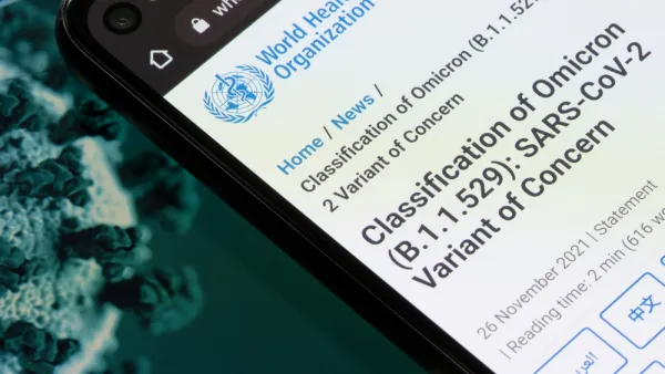 An image showing a smart phone with information from the World Health Organization about the Omicron variant of the coronavirus.