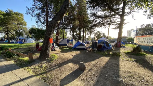 This is a panoramic photograph taken on April 1st, 2021, of People's Park in Berkeley, California. During the COVID-19 pandemic the authorities eased restrictions on overnight camping by homeless persons on the grounds of People's Park. The photograph shows the presence of some of the tents set up during this period.