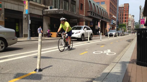 Cyclist riding on a downtown Pittsburgh bike lane