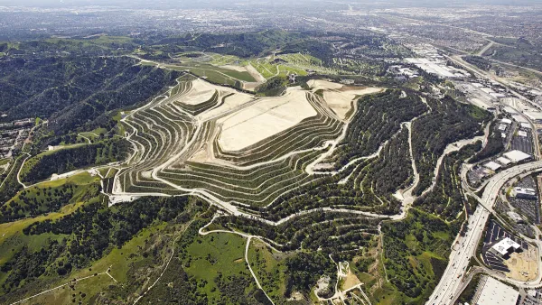 Aerial view of Puente Hills landfill on green hill in Los Angeles County, California.