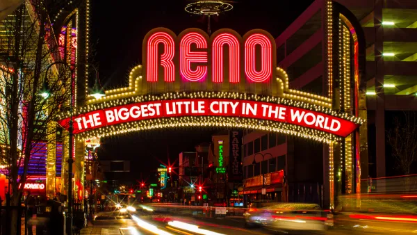 The famous (newer) "Biggest Little City in the World" sign in Reno, Nevada, with blurred lights from passing cars.