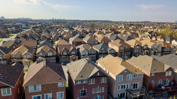 Row after row after row of single-family residences, with the high rises of the city of Toronto looming far in the background.