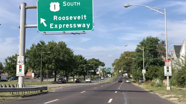 View of three-lane Roosevelt Boulevard with green Roosevelt Expressway road sign in Philadelphia, Pennsylvania.