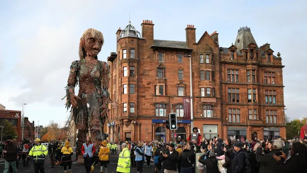 A giant puppet of a sea goddess made entirely of recycled materials walked through Glasgow during the COP26 climate change summit.
