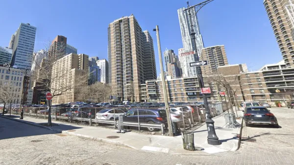 Google Street view of 250 Water Street parking lot with tall buildings in background