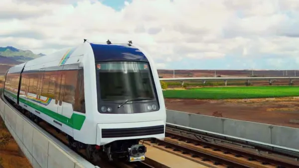 Rendering of white Honolulu light railtrain speeding past landscape