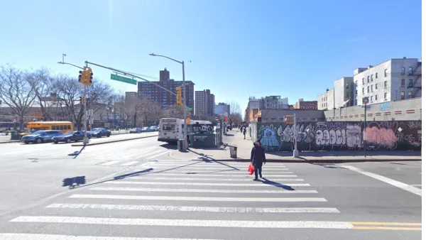 Google street view of New York City intersection with construction fence