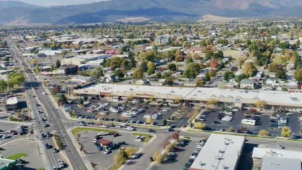 Aerial view of midtown Missoula, Montana with mountains in background
