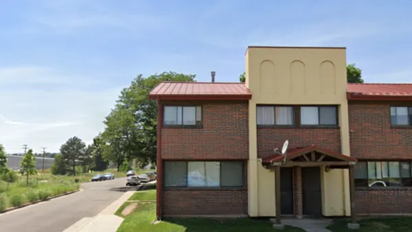 Google street view of two-story brick and stucco apartment building in Sun Valley neighborhood of Denver, Colorado.
