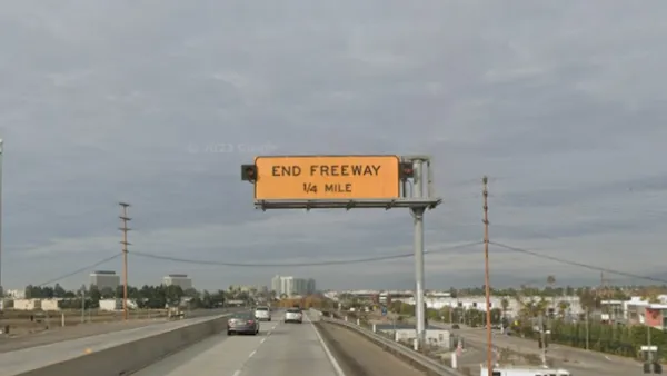 Google street view of yellow "End Freeway 1/4 mile" sign on 90 freeway in Los Angeles, California.