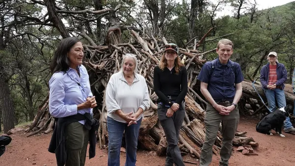 Interior Secretary Deb Haaland standing in a forested area in Colorado to celebrate recent action by the Biden-Harris administration to withdraw around 220,000 acres in the Thompson Divide area for mineral leasing on 1 July 2024.
