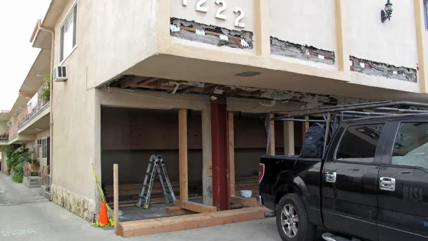 2-story Los Angeles dingbat apartment building getting soft-story seismic retrofit for earthquake safety