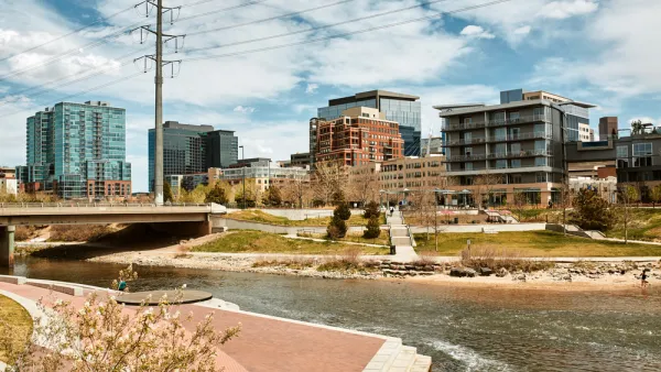South Platte River surrounded by apartments and office buildings at Shoemaker Plaza in Confluence Park. Denver, Colorado