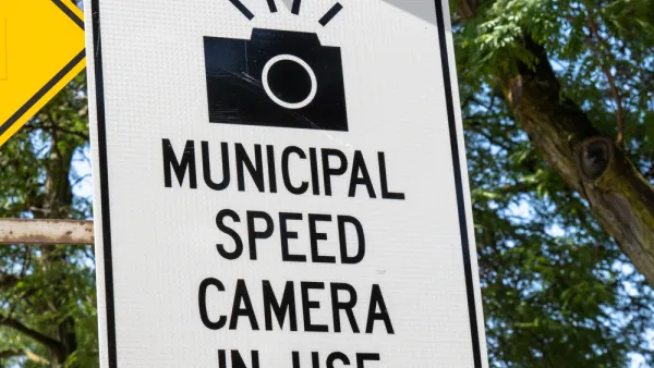 "Municipal speed camera in use" sign