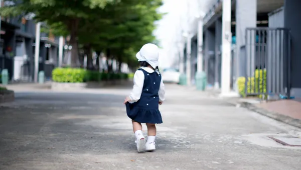 Toddler walking on street