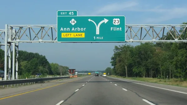 Green highway signs on Highway 23 for Ann Arbor and Flint, Michigan.