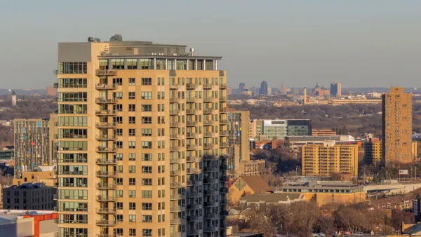 View of St. Paul skyline from Minneapolis with apartment building in foreground