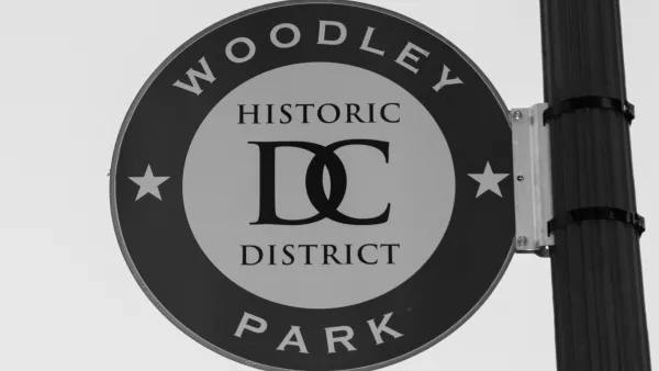 A sign on the side of a street light reads “Woodley Park Historic District D.C.”
