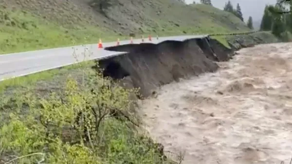 Floodwaters and damaged road in Yellowstone National Park