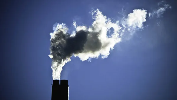 Smokestack with billowing smoke