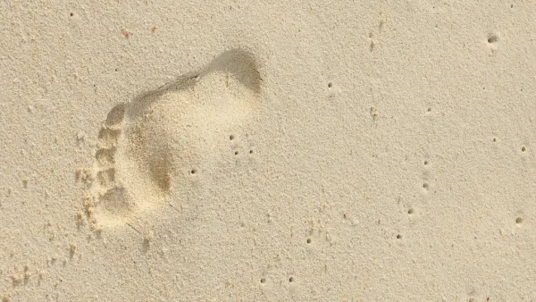 Footprint on sand at beach