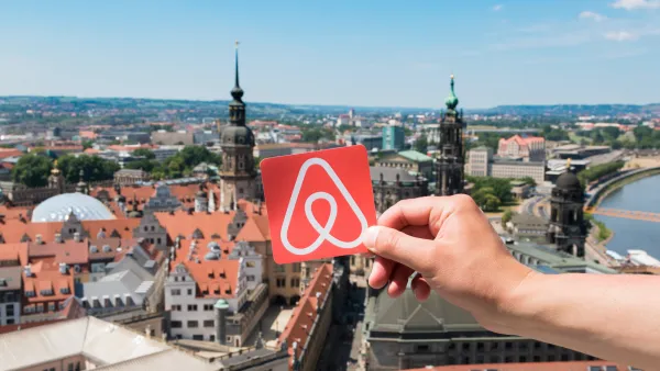 Airbnb logo over Dresden