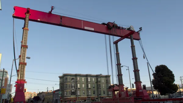 Construction crane and equipment on 4th Street for Central Subway project in San Francisco, California