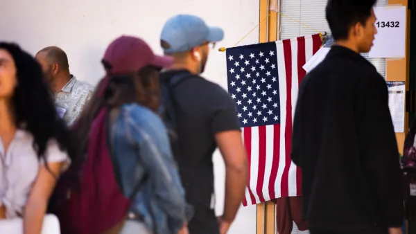 Group of people waiting in line at polling place
