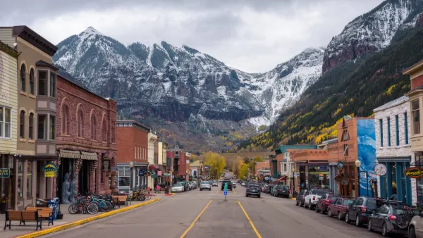 View from middle of street in downtown Telluride, Colorado with mountains in background