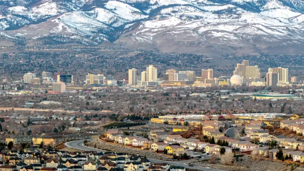 Aerial view of Reno, Nevada against snow-capped mountains in winter
