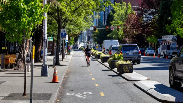 Two-way bike lane in downtown Seattle, Washington protected wtih concrete curbs