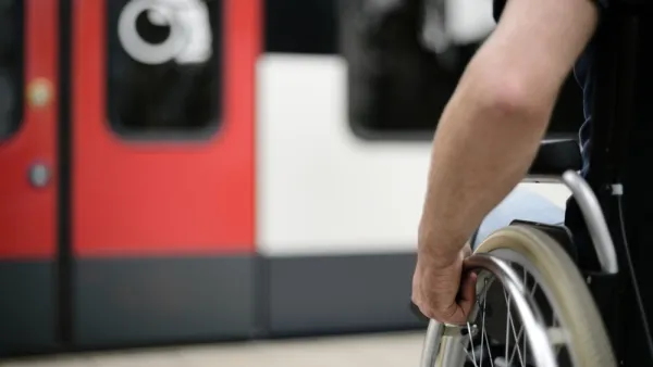 Close-up of wheelchair user on subway platform