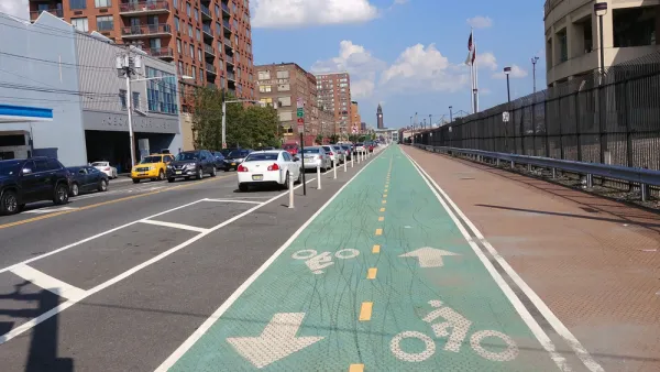 Green painted bike lane with delineators in Hoboken, New Jersey