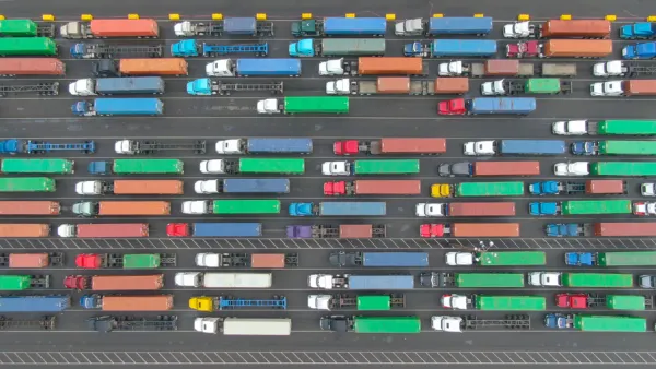 Aerial top-down view of multicolored big rig trucks in lines at the Port of Los Angeles