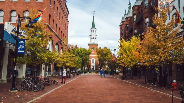 View down brick street in Burlington, Vermont with church at end