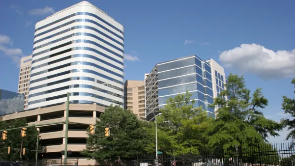 Richmond skyline with multistory parking garage and office buildings.
