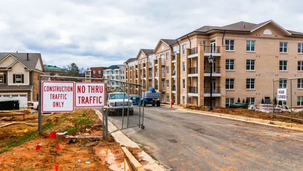 Construction site with 4-story apartment buildings in progress