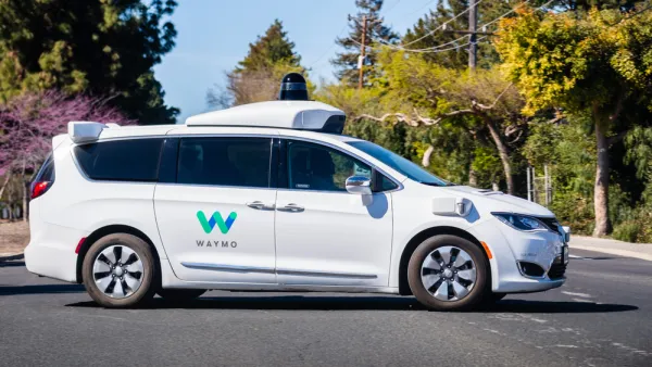 White Waymo autonomous minivan