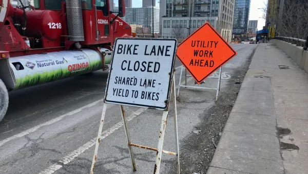 "Bike Lane Closed" and "Utility Work Ahead" signs on Chicago bike lane