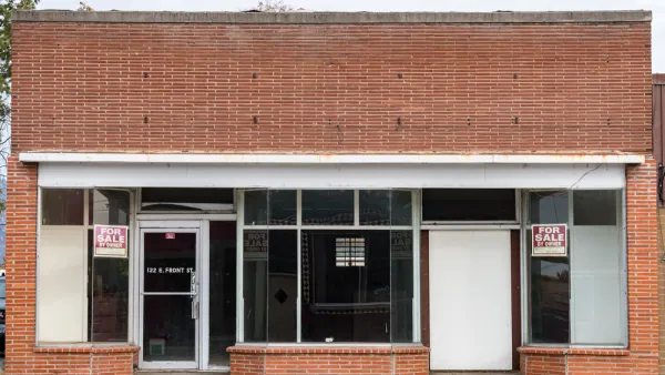 Line of vacant small storefronts with For Sale signs in Merrill, Oregon