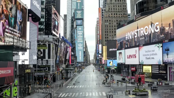 Empty New York City street during the COVID-19 pandemic with #NYSTRONG billboard in foreground.