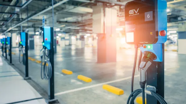 Close-up of row of electric car charging stations in a covered garage structure