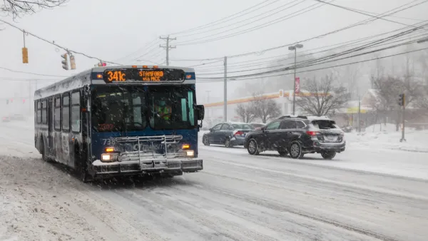 CTtransit bus driving through snowy street in Norwalk, Connecticut