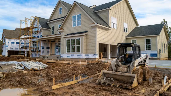 Single-family house with two-car garage under construction