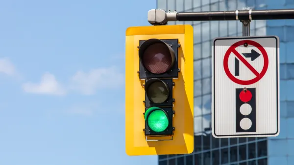 Stoplight with green light and "no right turn on red" pictograph on overhead signal