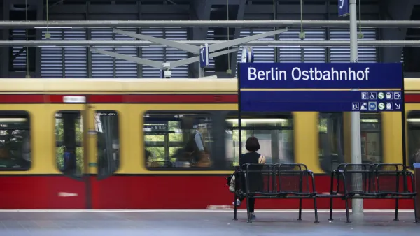 A platform of the Berlin East Railway station with a waiting traveler and a tram on June 17, 2014 in Berlin