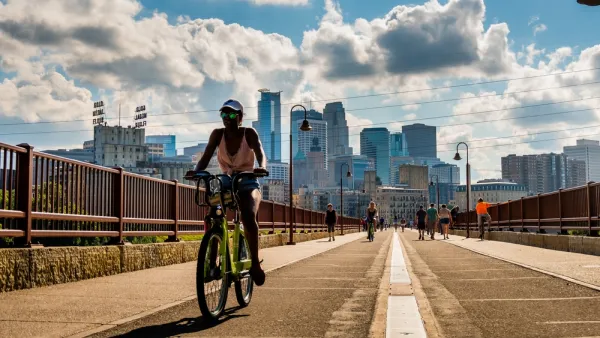 Bike on bridge in Minneapolis with skyline in background