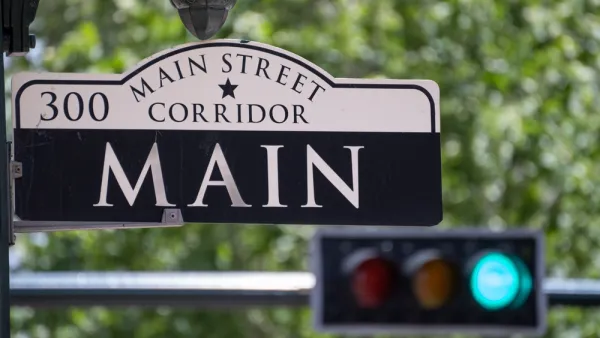 Main Street Sign with Traffic Light in the Background in Downtown Houston, Texas