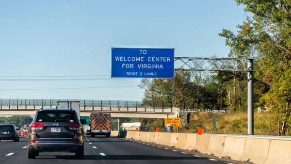 Interstate 95 near Fredericksburg, Virginia with blue sign that says "To Welcome Center for Virginia"