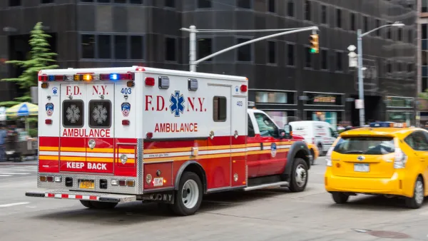 Ambulance driving down New York City street